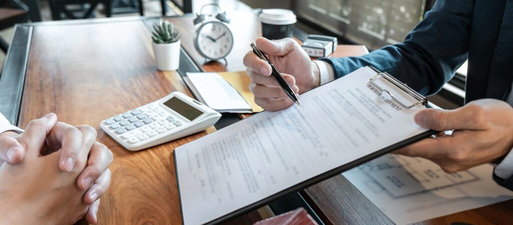 Small business owner reviewing financial metrics to qualify for a business loan